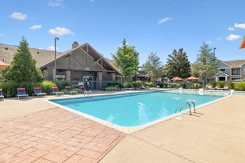 Outdoor pool with tanning shelf